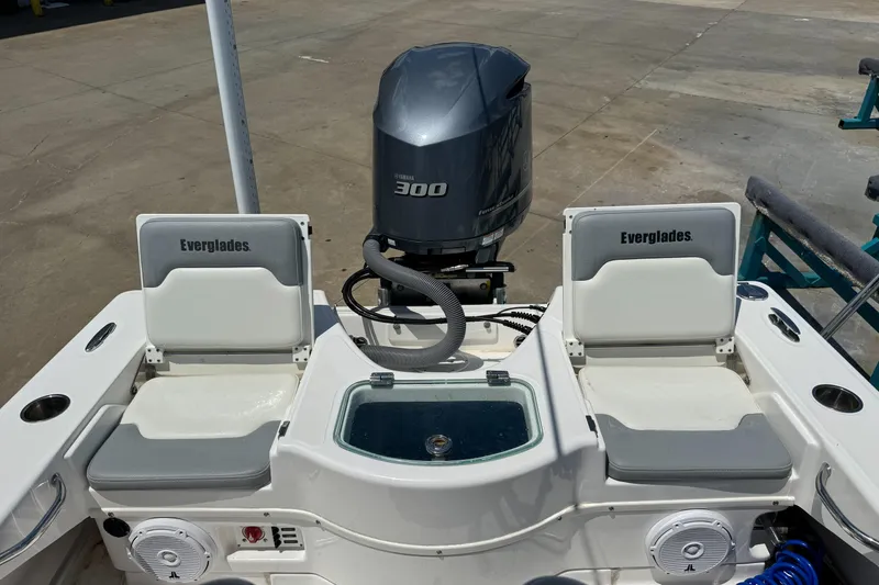 Slide: The Image of 2017 Everglades 243 Center Console boat with Yamaha 300 engine, featuring dual seats and storage. - 11