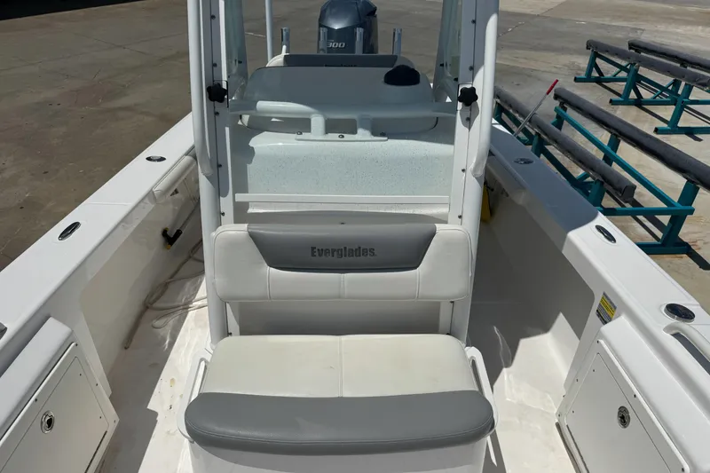 Slide: The Image of 2017 Everglades 243 Center Console boat interior with seating and console view. - 7
