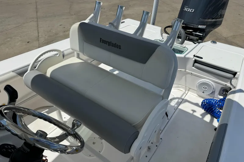 Slide: The Image of 2017 Everglades 243 Center Console boat interior with steering wheel and seating. - 8