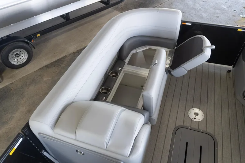 Slide: The Image of Interior of 2026 SunCatcher Fusion 324SL boat with gray seating and storage compartments. - 10