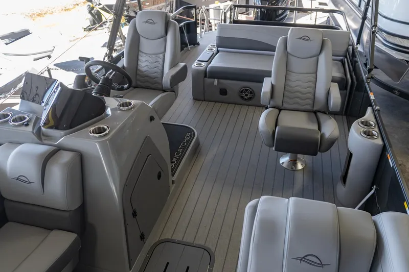 Slide: The Image of Luxurious interior of 2026 SunCatcher Fusion 324SL pontoon boat with plush seating. - 14
