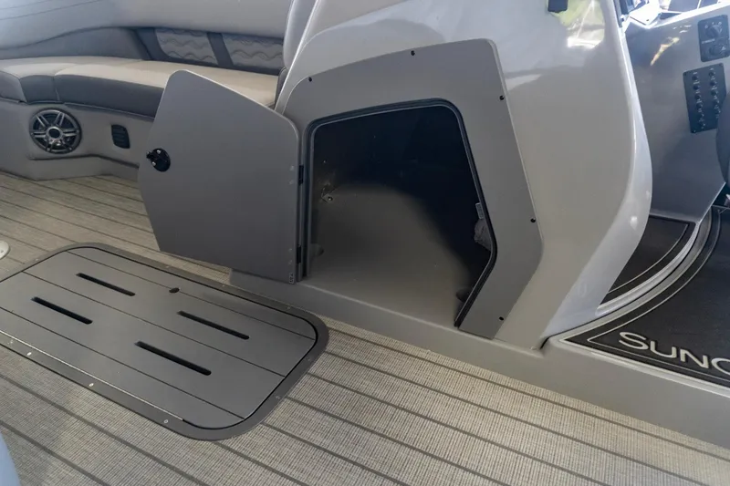 Slide: The Image of Interior of 2026 SunCatcher Fusion 324SL boat, featuring open storage compartment and seating area. - 15