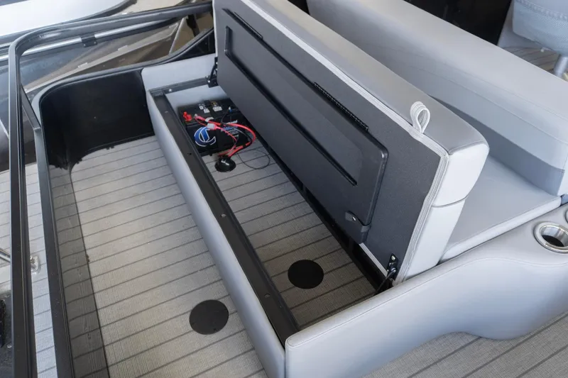 Slide: The Image of SunCatcher Fusion 324SL 2026 boat interior with open storage compartment and visible wiring. - 3