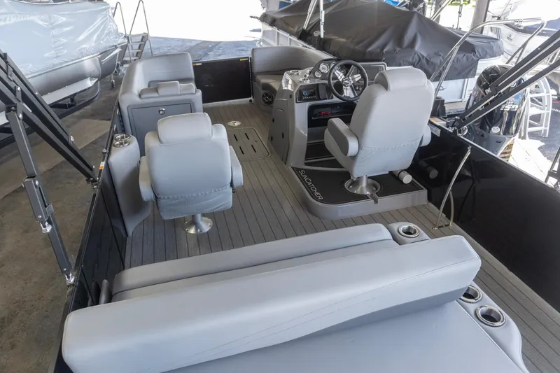 Slide: The Image of Interior of 2026 SunCatcher Fusion 324SL pontoon boat with modern seating and helm. - 4