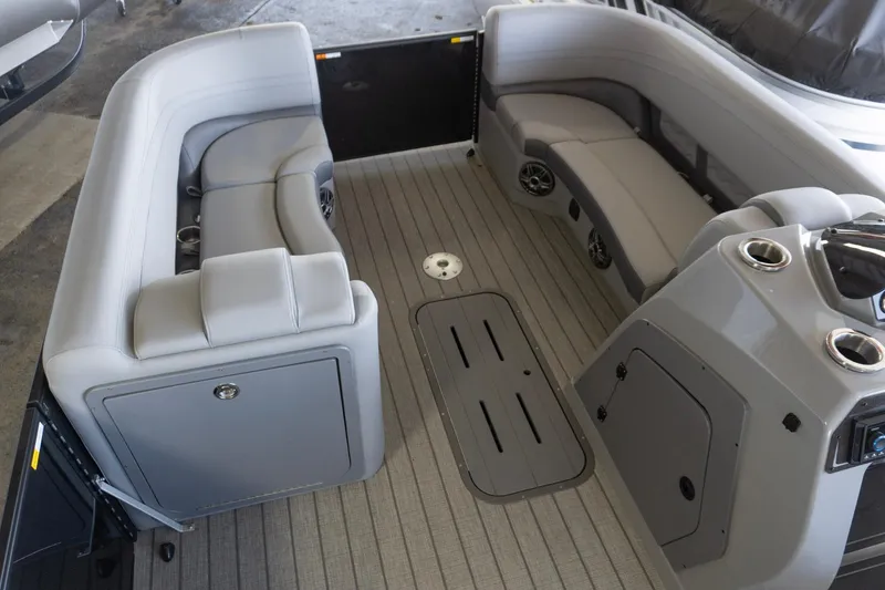 Slide: The Image of Interior of 2026 SunCatcher Fusion 324SL boat with gray seating and modern design. - 8