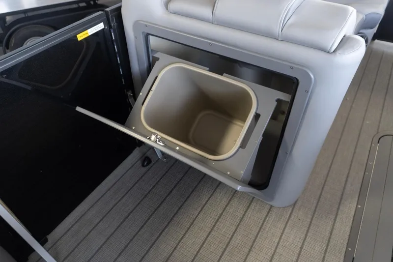 Slide: The Image of Built-in storage compartment on 2026 SunCatcher Fusion 324SL boat. - 9