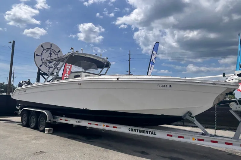 The Image of 2011 Jefferson Marlargo FS35 boat on trailer under cloudy sky. - 0