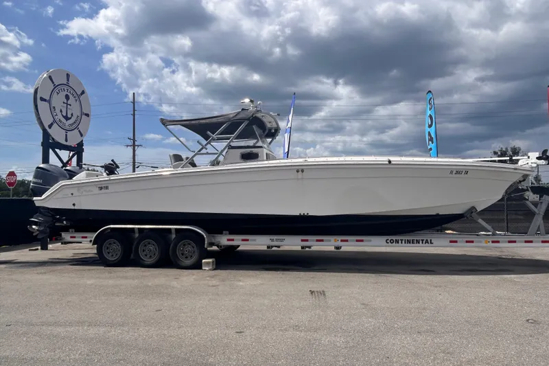 Slide: The Image of 2011 Jefferson Marlargo FS35 boat on trailer under cloudy sky. - 1