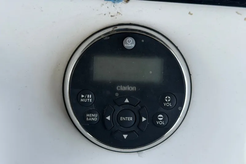 Slide: The Image of Clarion audio control panel on 2011 Jefferson Marlago FS35 boat dashboard. - 41