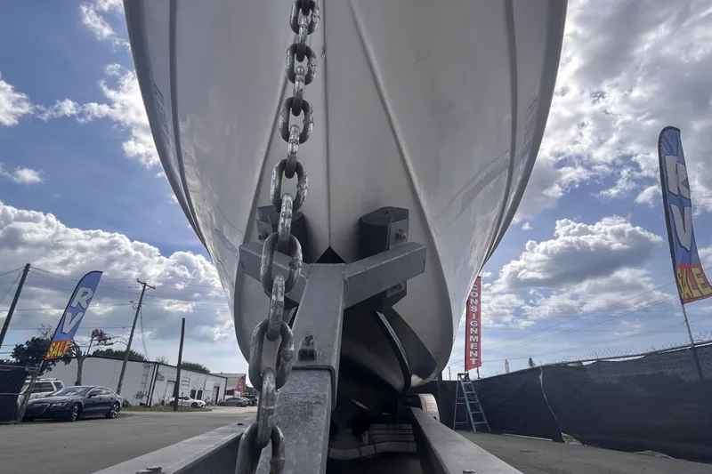 Slide: The Image of Boat hull of 2011 Jefferson Marlargo FS35 on trailer under cloudy sky. - 13