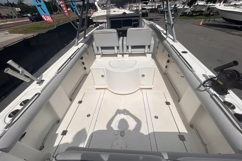 Slide: The Image of Open deck of a 2011 Jefferson Marlargo FS35 boat, featuring seating and storage compartments. - 16