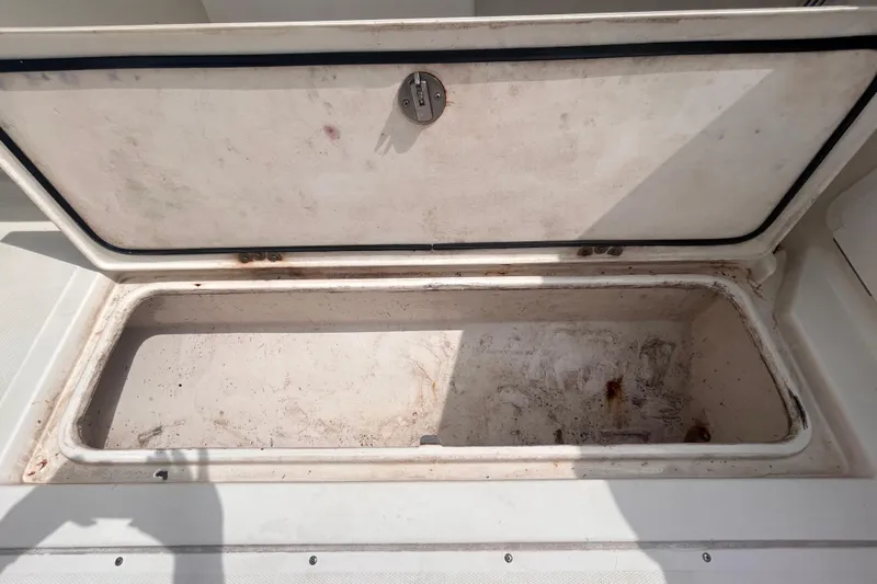 Slide: The Image of Open storage compartment on a 2011 Jefferson Marlago FS35 boat. - 18