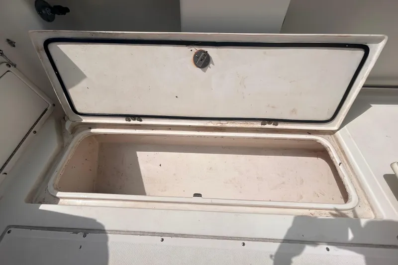 Slide: The Image of Open storage compartment on a 2011 Jefferson Marlago FS35 boat. - 20
