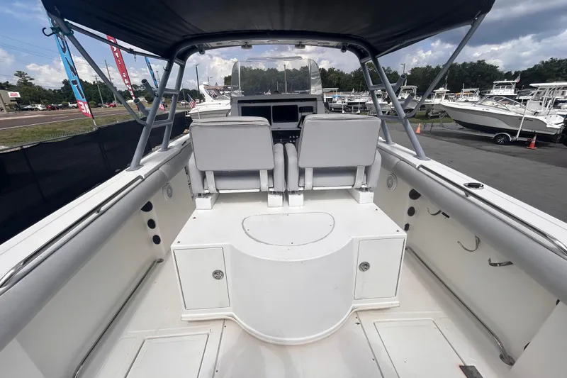 Slide: The Image of Interior view of a 2011 Jefferson Marlargo FS35 boat, showcasing seating and helm area. - 21