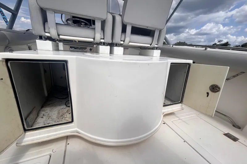 Slide: The Image of Open storage compartments on a 2011 Jefferson Marlargo FS35 boat under cloudy skies. - 23