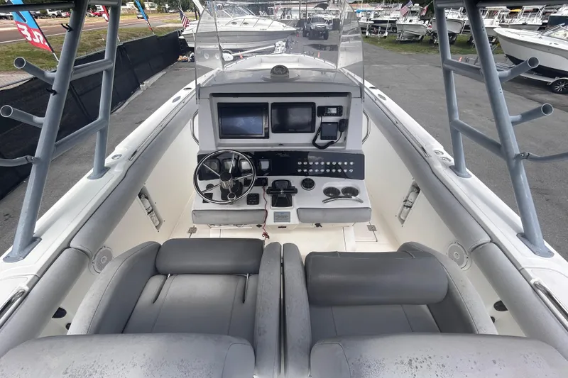 Slide: The Image of Cockpit of a 2011 Jefferson Marlargo FS35 boat with steering wheel and controls. - 24
