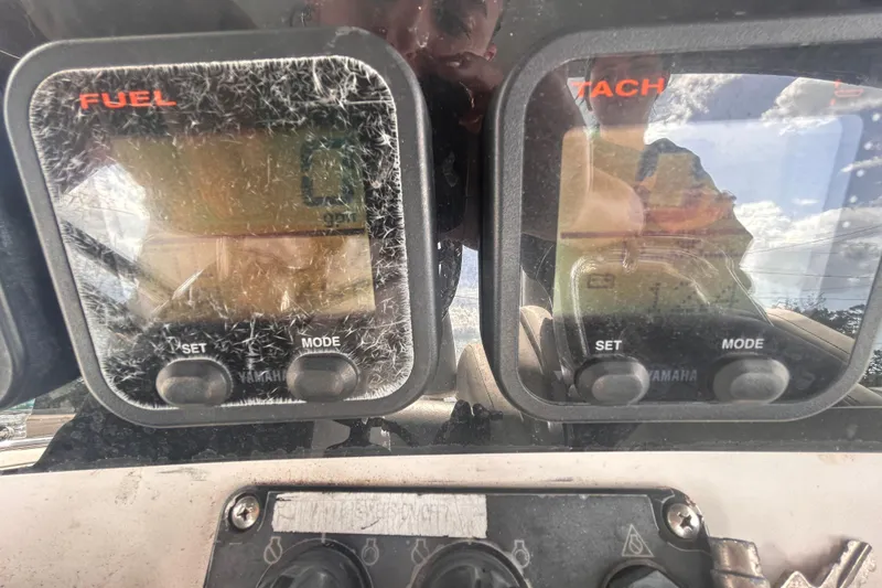 Slide: The Image of Close-up of Jefferson Marlargo FS35 dashboard gauges, showing fuel and tachometer readings. - 26