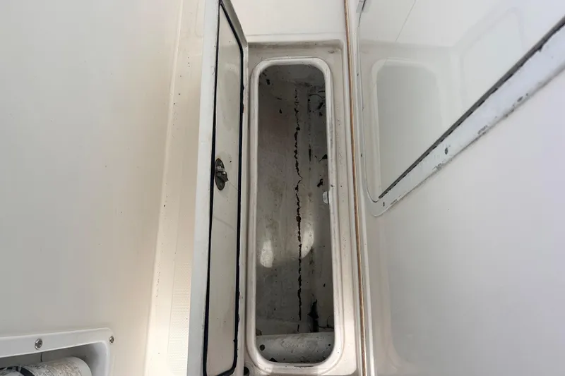 Slide: The Image of Open storage compartment on a 2011 Jefferson Marlargo FS35 boat. - 29
