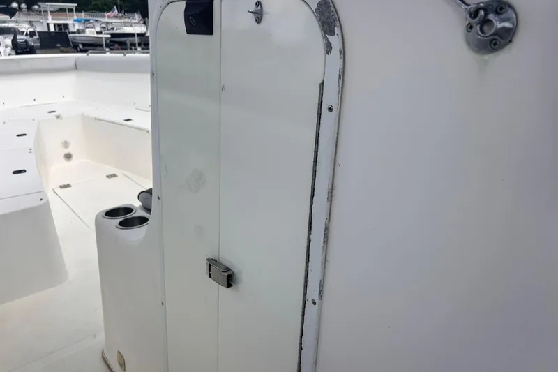 Slide: The Image of 2011 Jefferson Marlargo FS35 boat interior with storage compartment and cup holders. - 30