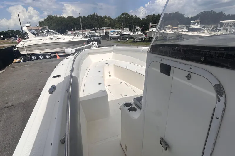 Slide: The Image of 2011 Jefferson Marlargo FS35 boat docked, showcasing spacious deck and sleek design. - 32