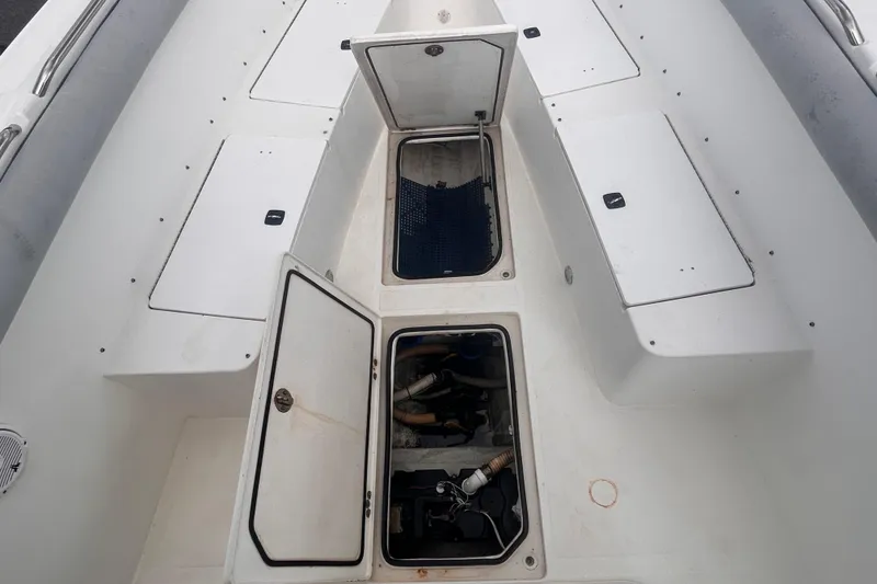 Slide: The Image of Open storage compartments on a 2011 Jefferson Marlago FS35 boat. - 35