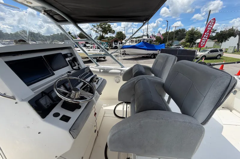 Slide: The Image of Interior view of a 2011 Jefferson Marlago FS35 boat with steering console and seating. - 31