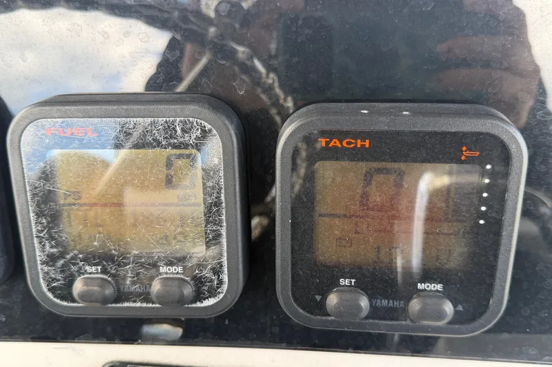 Slide: The Image of Close-up of Yamaha fuel and tachometer gauges on a 2011 Jefferson Marlago FS35 boat. - 39