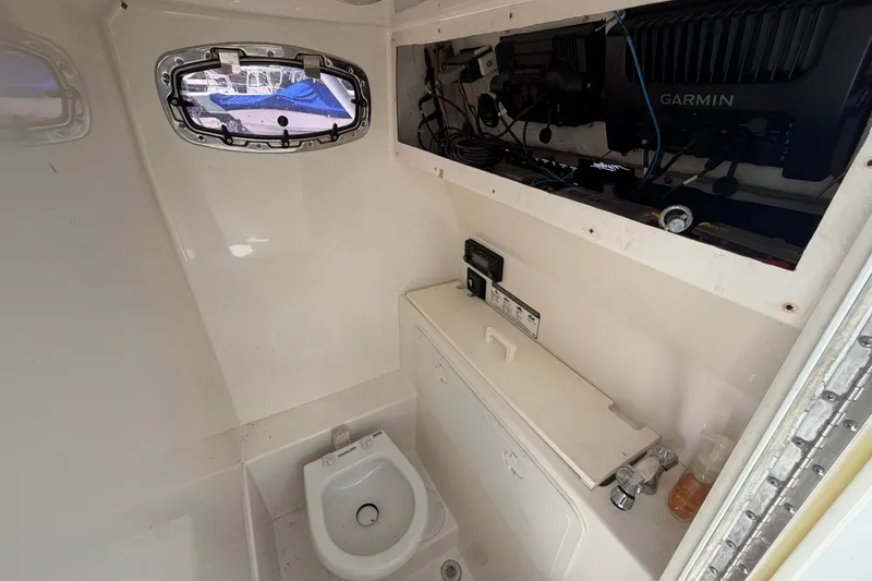 Slide: The Image of Interior of 2011 Jefferson Marlago FS35 boat with toilet and Garmin equipment. - 49