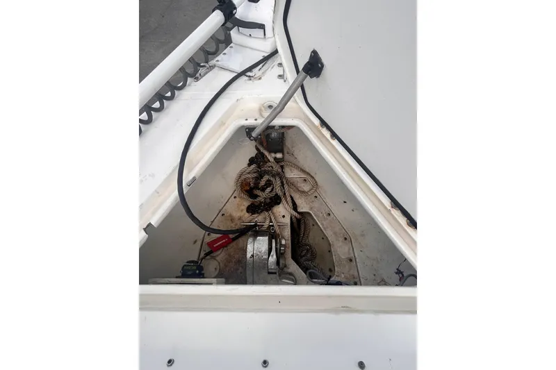 Slide: The Image of Anchor compartment of 2011 Jefferson Marlargo FS35 boat with coiled rope and equipment. - 42