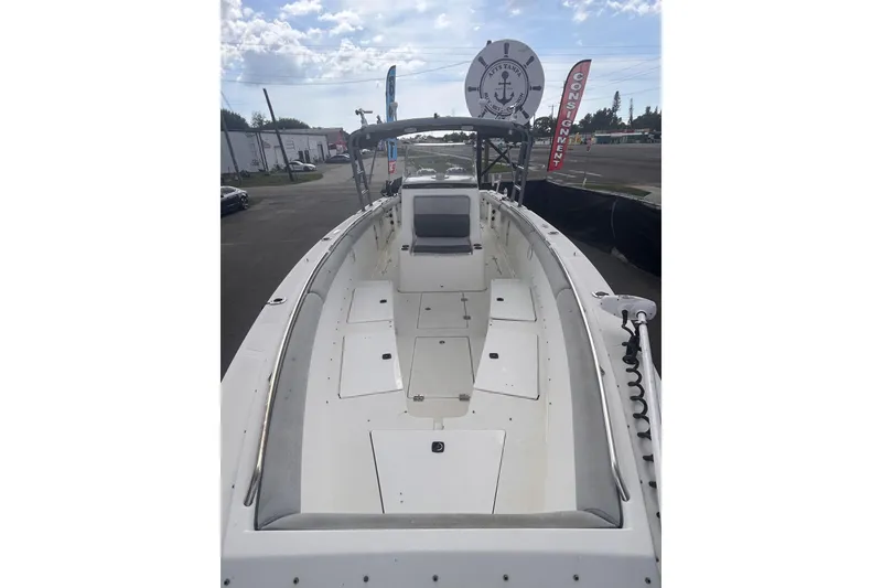 Slide: The Image of 2011 Jefferson Marlargo FS35 boat, white interior, docked outdoors under cloudy sky. - 43