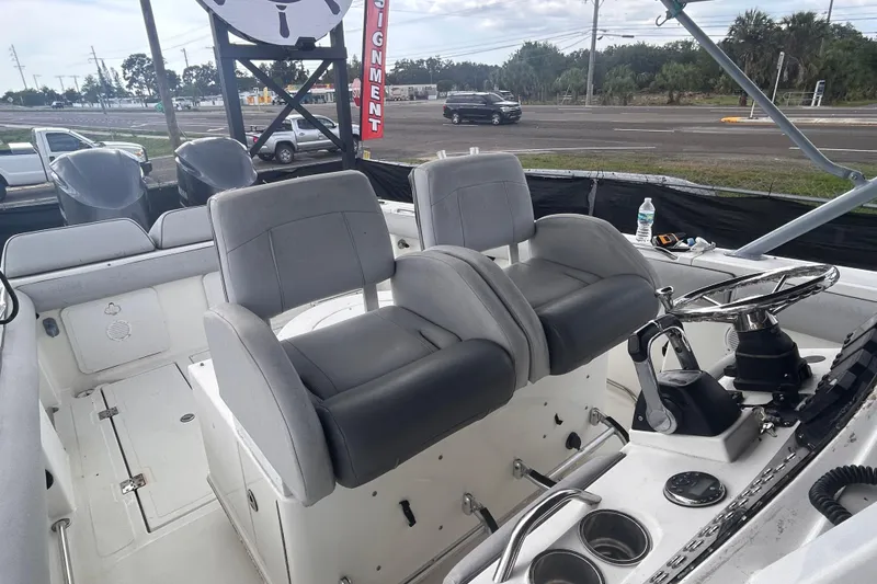 Slide: The Image of Interior of a 2011 Jefferson Marlargo FS35 boat with dual captain's chairs and steering console. - 49