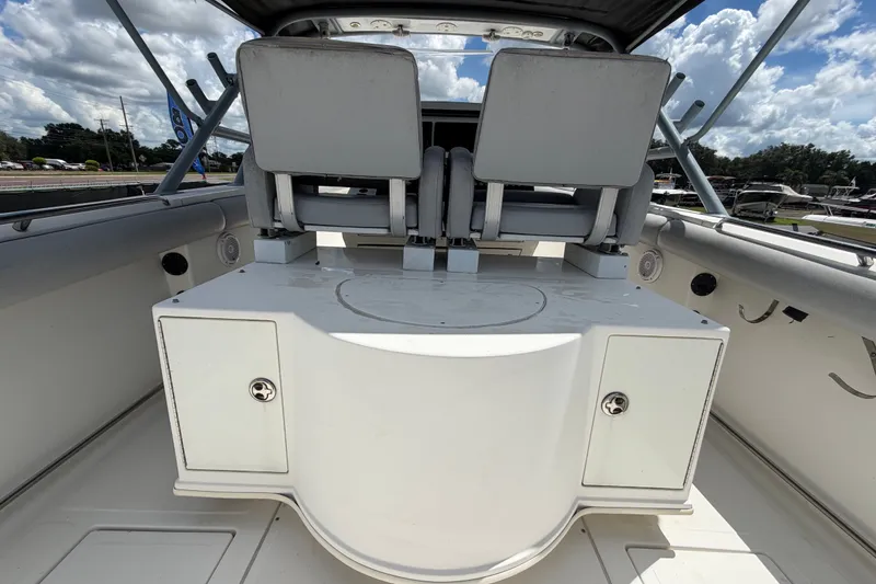 Slide: The Image of 2011 Jefferson Marlago FS35 boat interior with dual seats and storage compartments. - 21