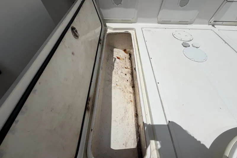 Slide: The Image of Open storage compartment on 2011 Jefferson Marlago FS35 boat deck. - 85
