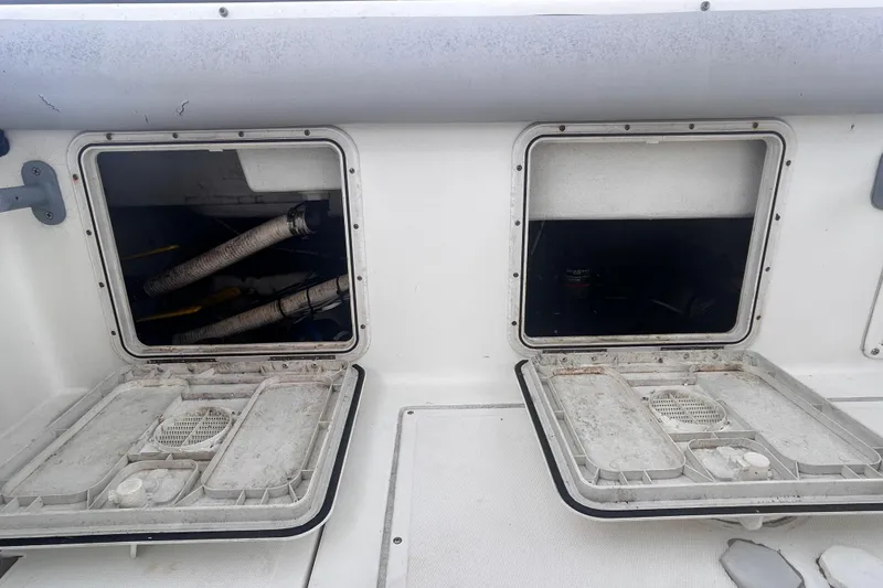 Slide: The Image of Open storage compartments on a 2011 Jefferson Marlargo FS35 boat deck. - 52