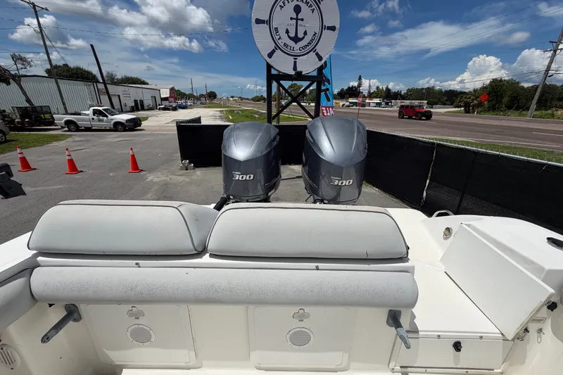 Slide: The Image of 2011 Jefferson Marlago FS35 boat with twin 300 horsepower engines, parked near a marina. - 87