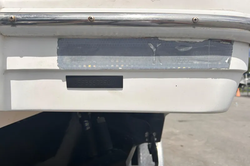Slide: The Image of Rear view of a 2011 Jefferson Marlargo FS35 boat with visible identification number. - 57