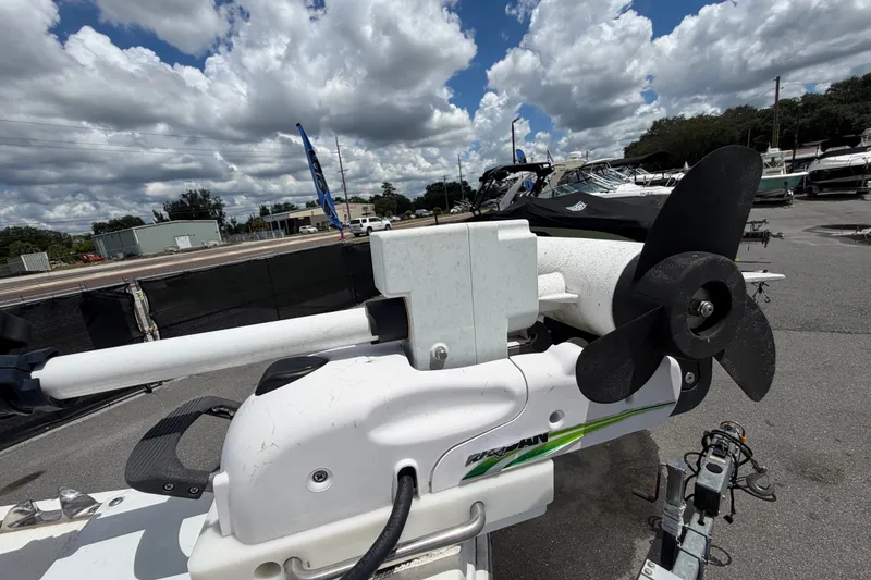 Slide: The Image of 2011 Jefferson Marlago FS35 boat motor with propeller, parked outdoors under cloudy sky. - 69