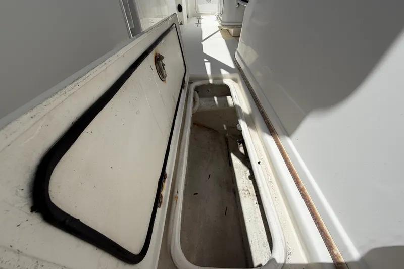 Slide: The Image of Open storage compartment on a 2011 Jefferson Marlago FS35 boat. - 77