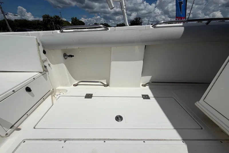 Slide: The Image of Interior view of a 2011 Jefferson Marlago FS35 boat, featuring storage compartments. - 19