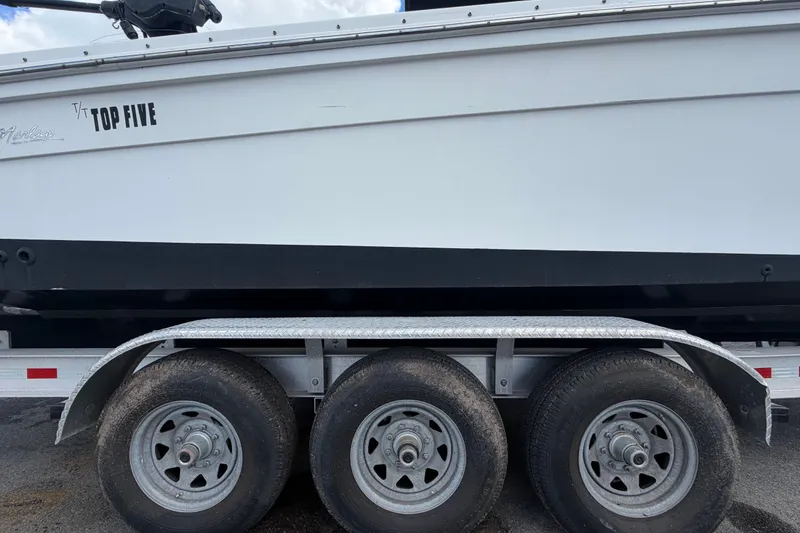 Slide: The Image of 2011 Jefferson Marlago FS35 boat on a triple-axle trailer, side view. - 97