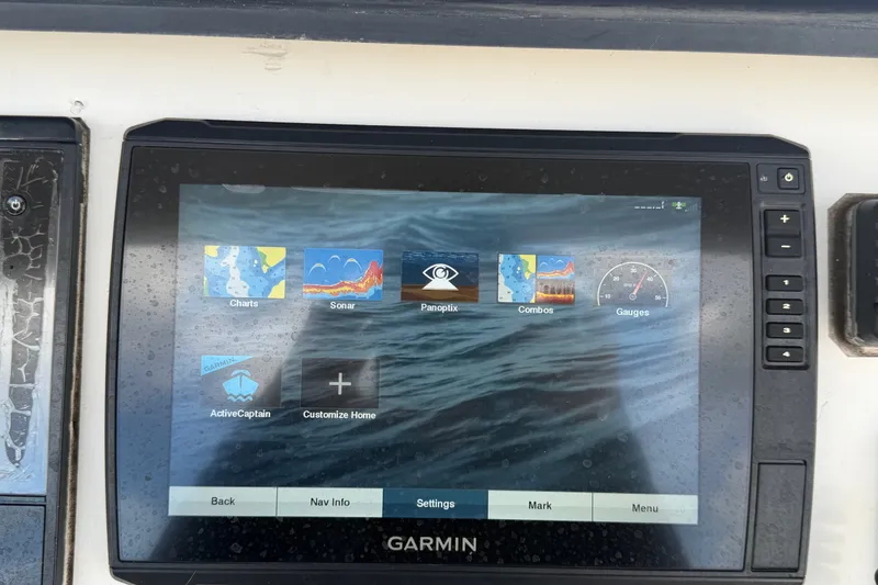 Slide: The Image of Garmin marine display on 2011 Jefferson Marlago FS35, showing navigation and sonar options. - 36