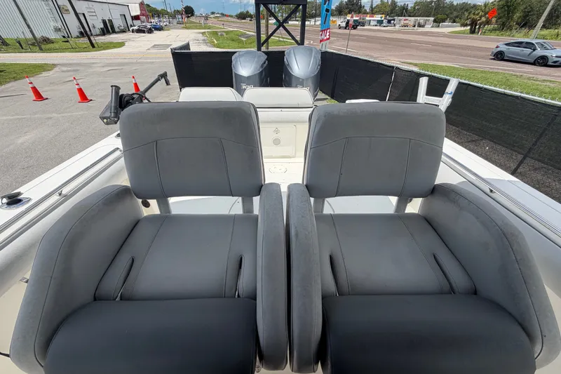 Slide: The Image of 2011 Jefferson Marlago FS35 boat seats with dual engines in a marina setting. - 82