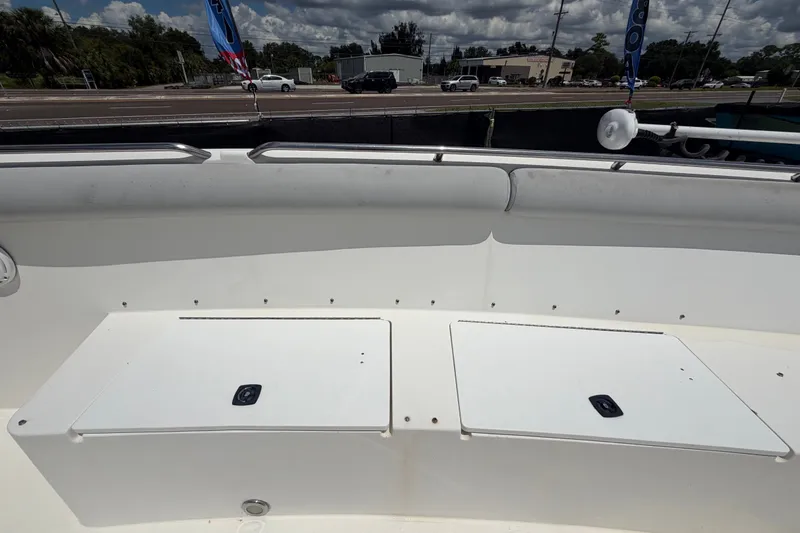 Slide: The Image of 2011 Jefferson Marlago FS35 boat deck with storage compartments, parked near a road. - 58