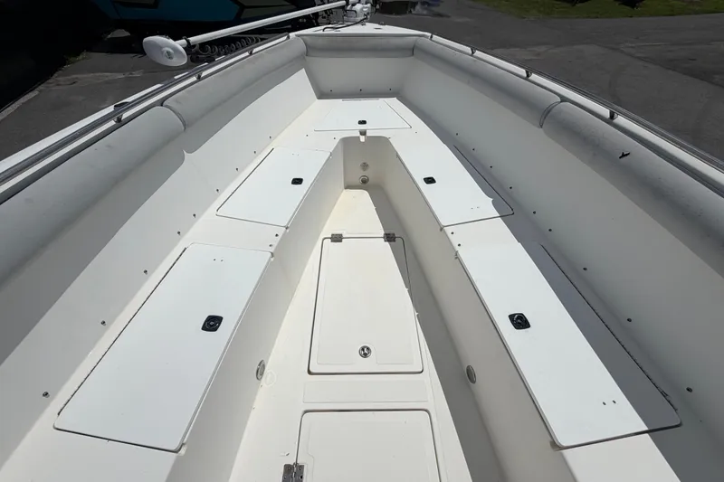 Slide: The Image of 2011 Jefferson Marlago FS35 boat interior with spacious seating and storage compartments. - 57