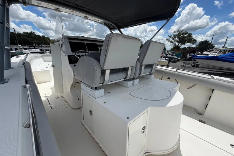 Slide: The Image of 2011 Jefferson Marlago FS35 boat interior with dual seats and steering console under a blue sky. - 26