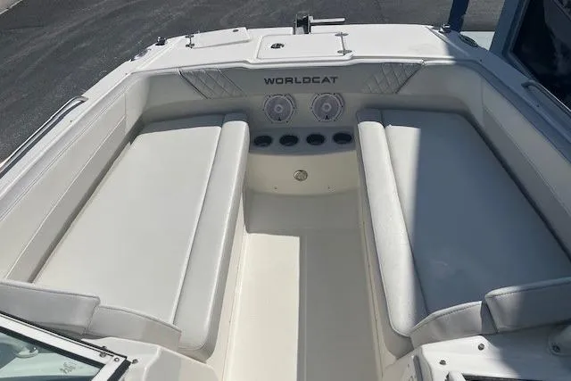 Slide: The Image of 2024 World Cat 230 SD boat interior with white seating and speakers. - 3