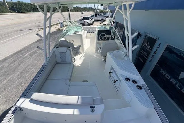 Slide: The Image of 2024 World Cat 230 SD boat interior with seating and steering console. - 7