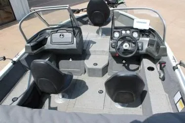 Slide: The Image of 2020 Tracker Pro Guide V-165 WT boat interior with steering console and seating. - 10