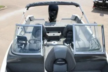 Slide: The Image of 2020 Tracker Pro Guide V-165 WT boat interior with open windshield and seating. - 11