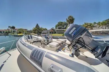 Slide: The Image of 1993 Viking Convertible boat with Yamaha engine docked in sunny marina. - 22